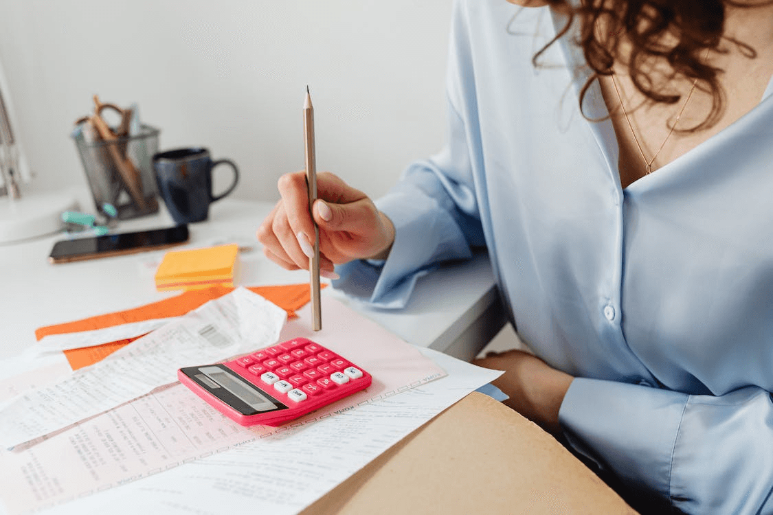 woman calculating changes in energy bills   